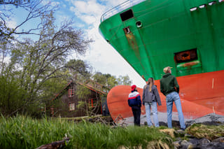 Photos: Norway cabin owner snoozes as cargo ship runs aground outside
