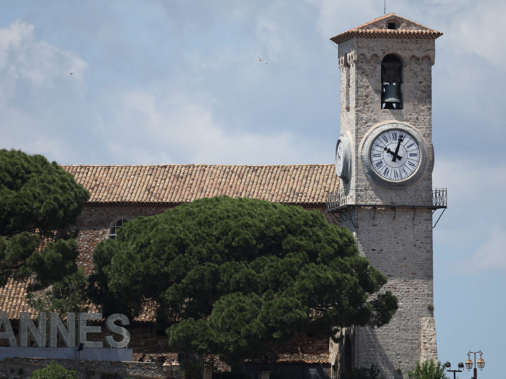 A clock remains stuck at a few minnutes past 10:00 am, the time at which a widescale power outage struck Southwestern France, on a clocktower in Canne's old district "Le Suquet", on the final day of the 78th edition of the Cannes Film Festival in Cannes.