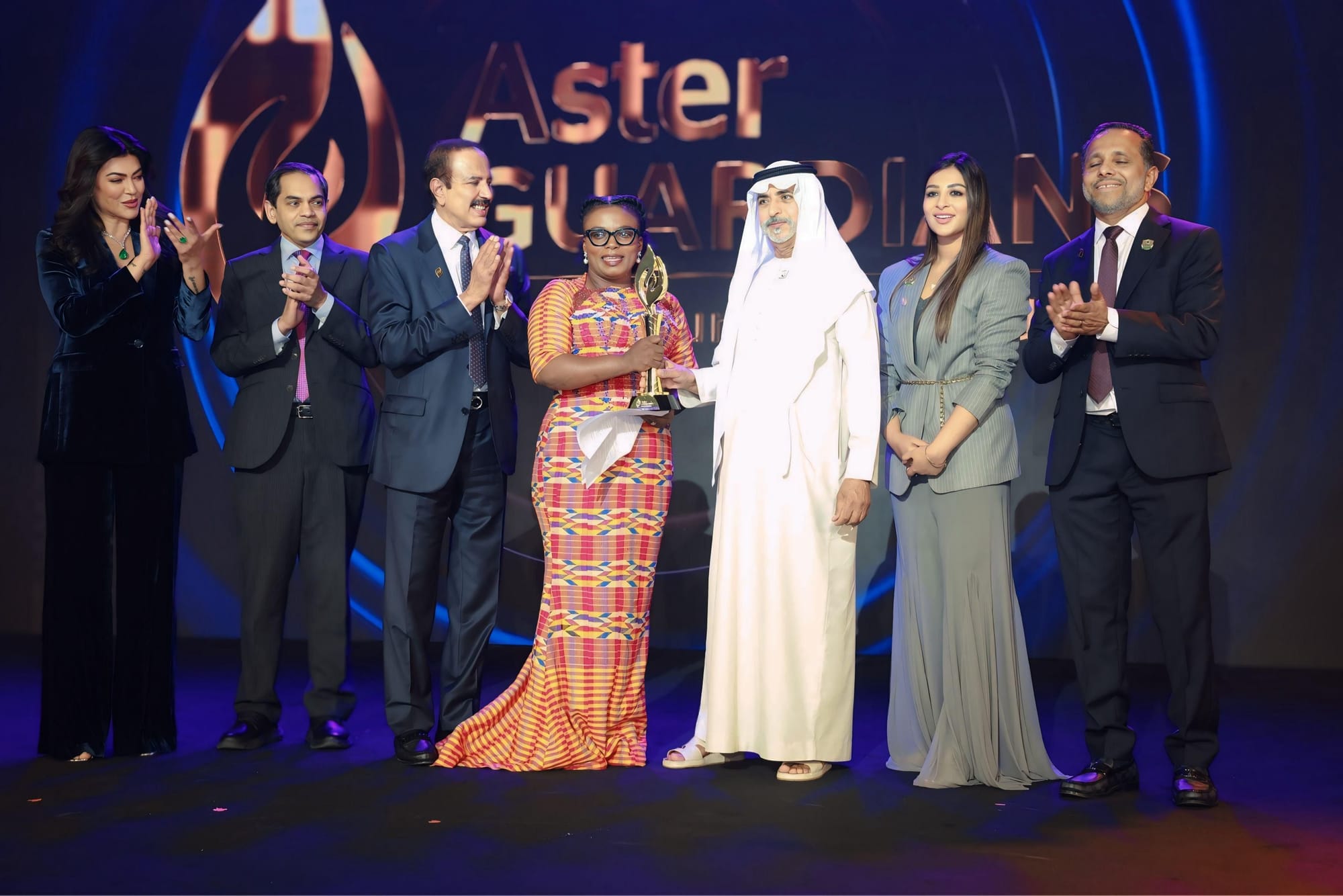 Sheikh Nahyan bin Mubarak Al Nahyan and Indian actress Sushmita Sen honour nurse Naomi Oyoe Ohene Oti, 48. Also seen in the photo are Dr Azad Moopen and Alisha Moopen.