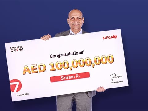 Sriram Rajagopalan with his ceremonial cheque for the whopping Dh100million prize money. 