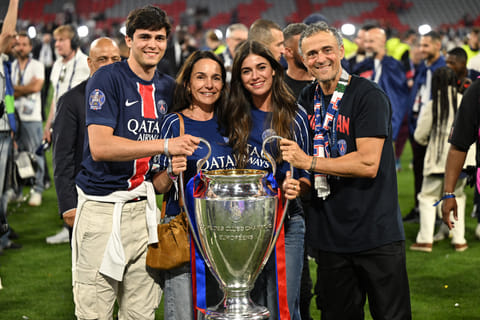 Paris Saint-Germain's headcoach Luis Enrique (right), his wife Elena Cullell (second  from left), son Pacho Martinez (left) and daughter Sira Martinez pose with the Champions League trophy in Munich on Saturday night.