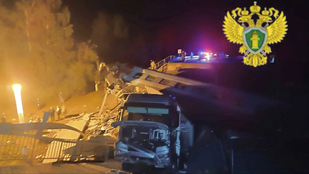 Emergency employees work at a damaged bridge in Russia's Bryansk region, which borders Ukraine.  