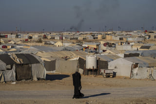 A woman walks in the al-Hol camp in northeastern Syria's Hasakeh province, where tens of thousands of mostly women and children linked to the Islamic State group have been living for years. File photo taken on Thursday, Jan. 30, 2025.