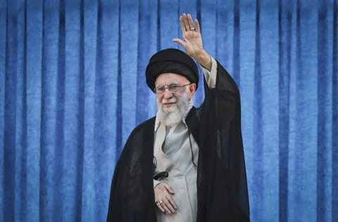 Iran Supreme Leader Ayatollah Ali Khamenei waves to the crowd as he arrives for a ceremony marking the anniversary of the 1989 death of the late revolutionary founder Ayatollah Khomeini at his shrine just outside Tehran, Iran, Wednesday, June 4, 2025.  