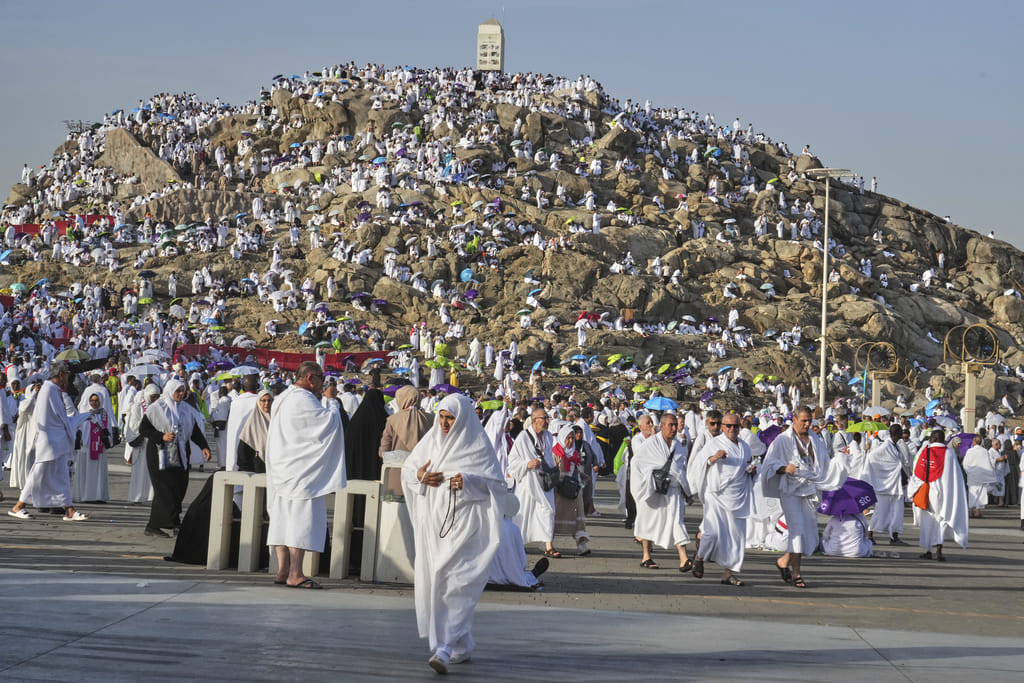 Pilgrims gather on top of the rocky hill known as the Mountain of Mercy, on the Plain of Arafat, during the annual Hajj pilgrimage near the holy city of Mecca, Saudi Arabia on June 5, 2025. 