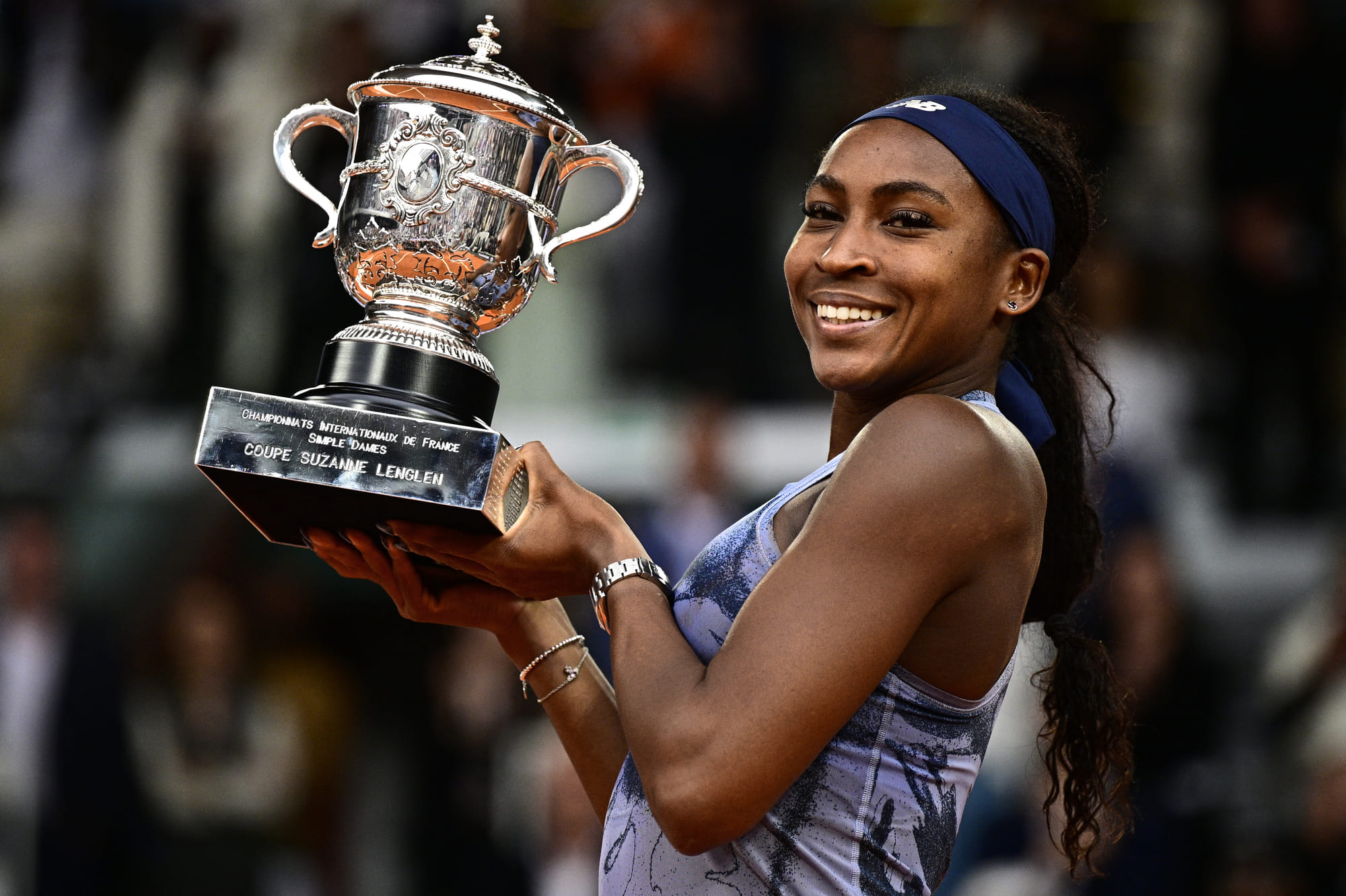 US Coco Gauff holds the trophy after winning the French Open tennis tournament women's singles final match.