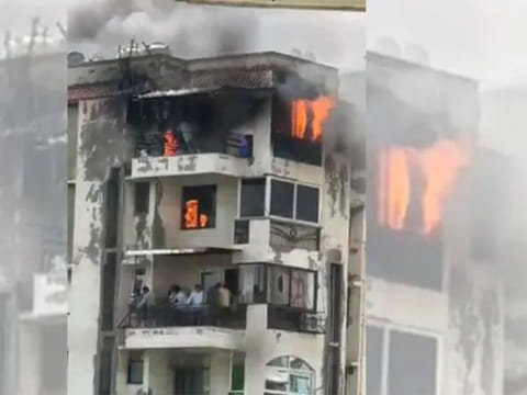 Massive flames erupted from the windows as thick plumes of smoke engulfed the upper floors.