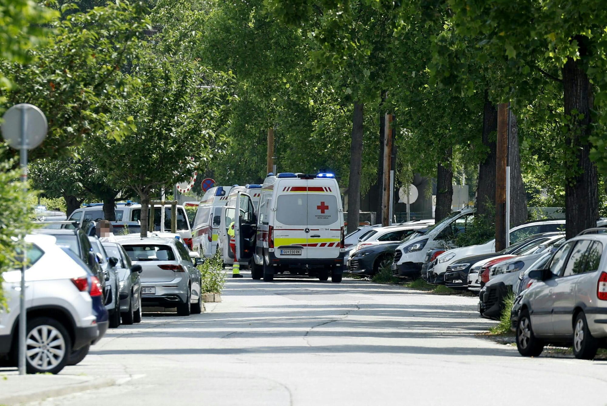 Ambulance cars are seen in a street close to a school where, according to reports, several people died in a shooting, on June 10, 2025 in Graz, southeastern Austria.