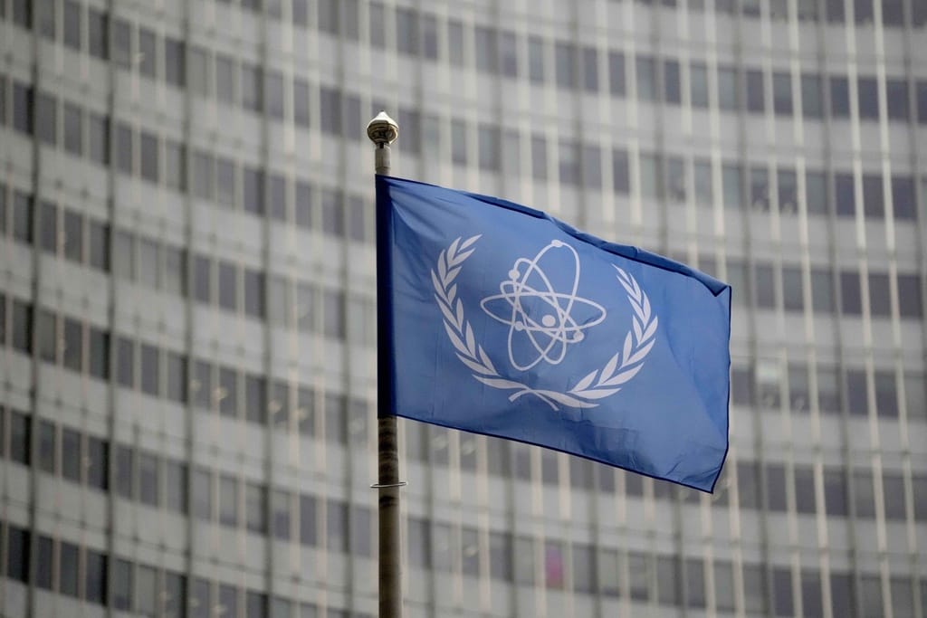 The flag of the International Atomic Energy Agency in front of its headquarters during an IAEA Board of Governors meeting in Vienna, Austria.