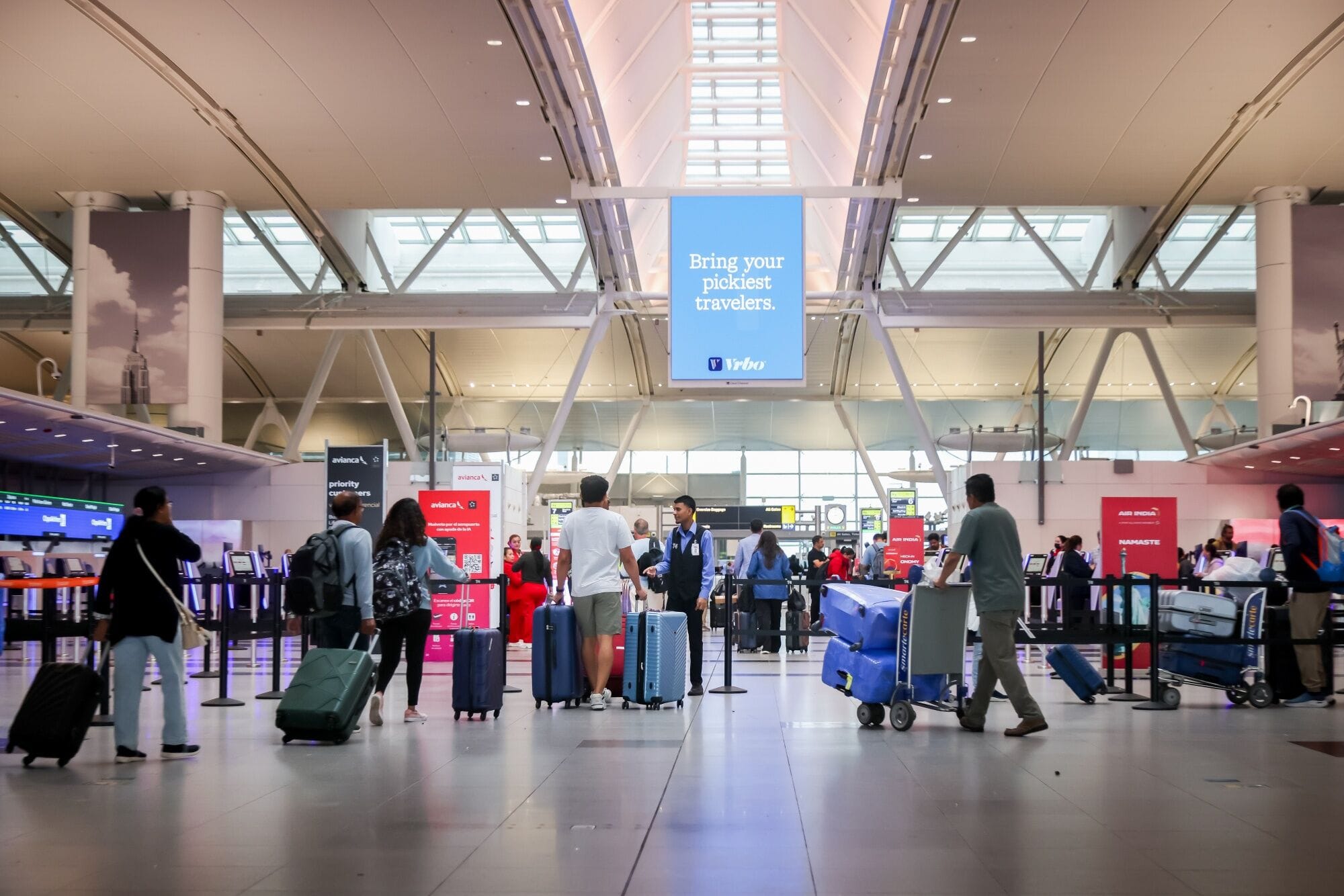 Travelers in Terminal 4 of John F. Kennedy International Airport (JFK) in New York, US, 