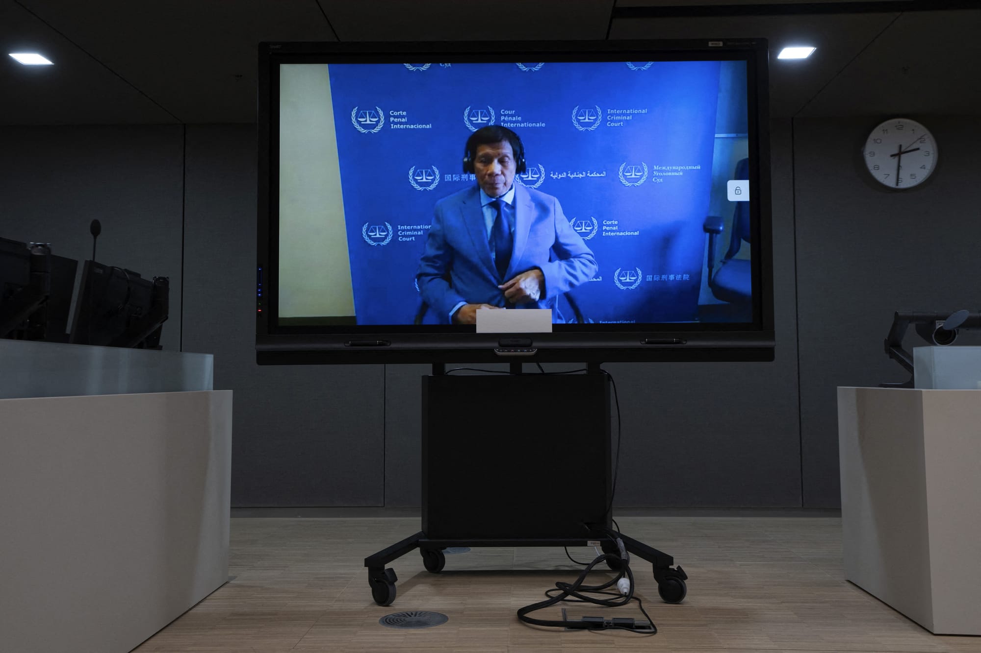 Former Philippine president Rodrigo Duterte seen on a screen in the courtroom during his first appearance before the International Criminal Court on charge of crimes against humanity over his deadly crackdown on narcotics, in The Hague