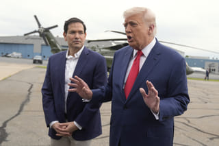 President Donald Trump, right, speaks with reporters as Secretary of State Marco Rubio listens upon arriving at Morristown Municipal Airport in Morristown, N.J., en route to Camp David, Maryland. File photo taken on Sunday, June 8, 2025.