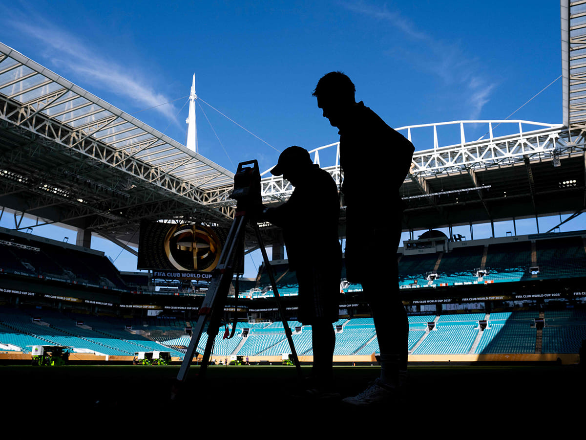 Workers get the pitch ready at the Hard Rock Stadium in Miami Gardens, Florida on June 13, 2025, on the eve of the Club World Cup 2025 Group A football match between Egypt's Al-Ahly and US Inter Miami. 