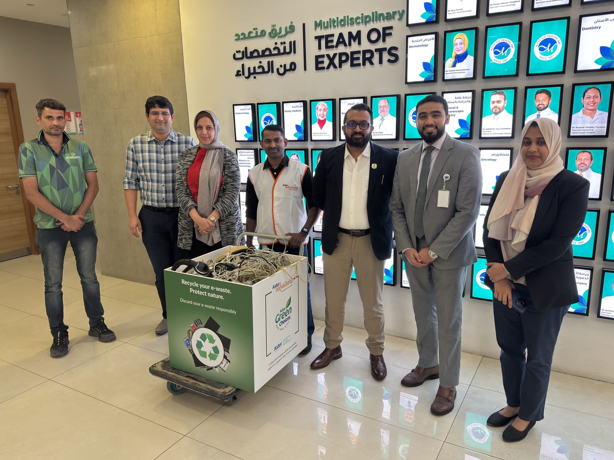 Aster Volunteers with an e-waste collection box at Aster Hospital Sharjah.