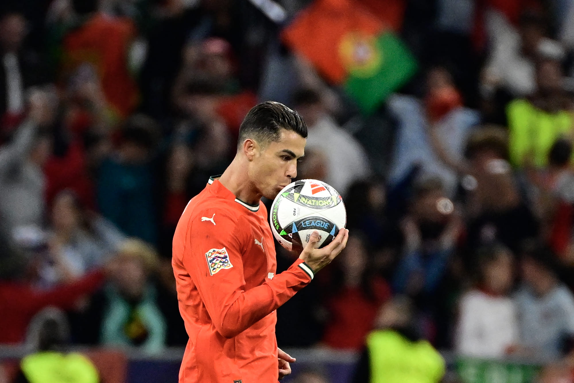 Portugal's forward Cristiano Ronaldo kisses the ball after scoring the 2-2 equaliser during the Uefa Nations League final football match against Spain in Munich, southern Germany on June 8, 2025.
