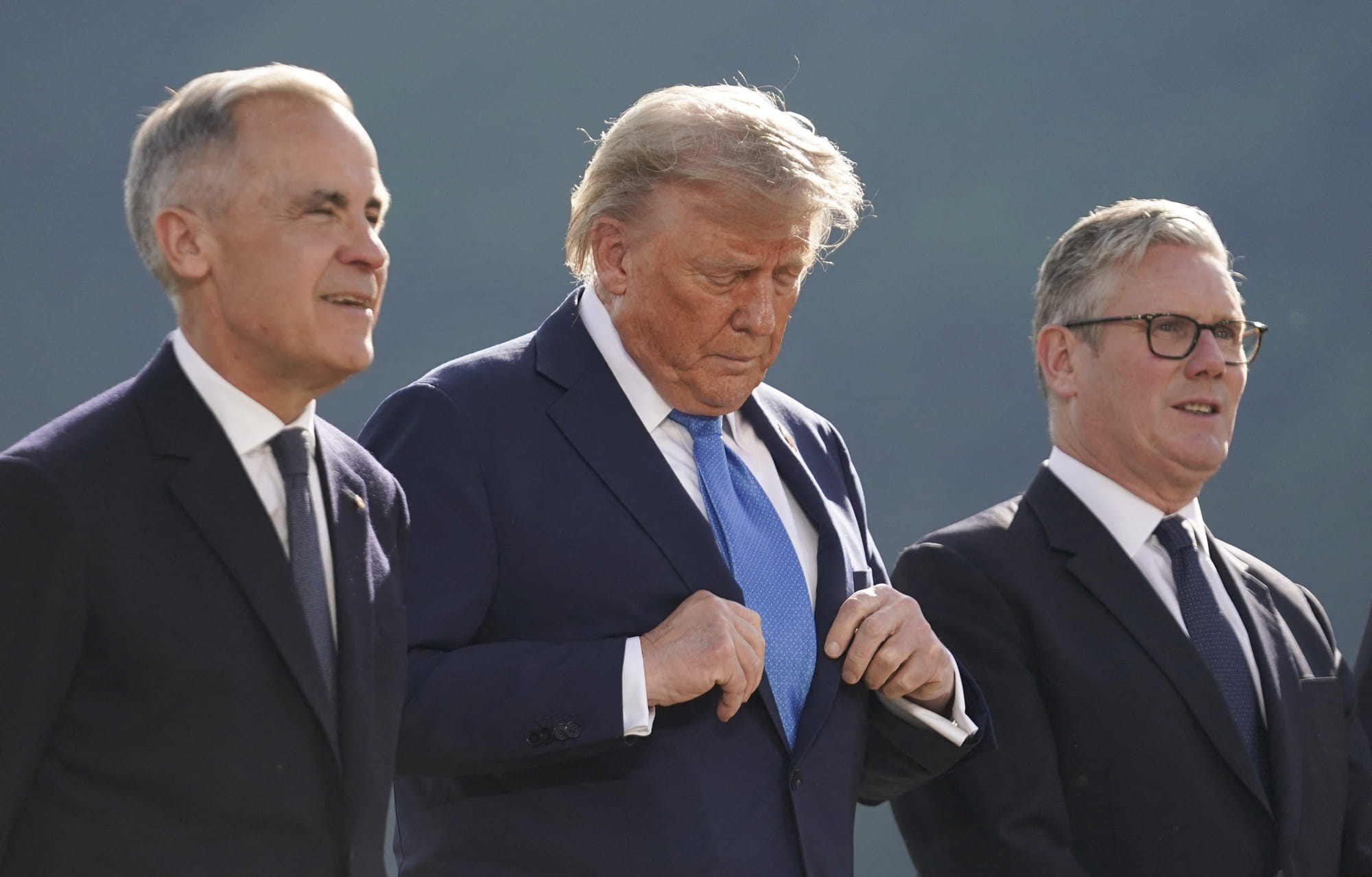 Canadian Prime Minister Mark Carney, US President Donald Trump and British Prime Minister Keir Starmer pose for a photo during the G7 Summit at the Kananaskis Country Golf Course in Kananaskis, Alberta, Canada on June 16, 2025.