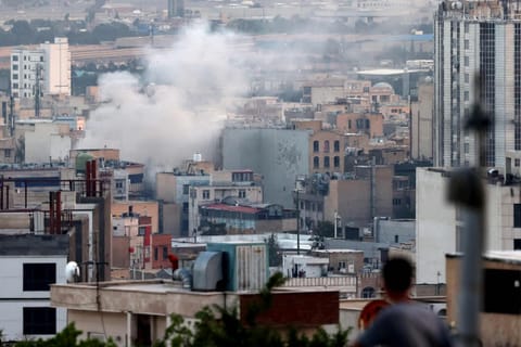 Smoke billows from an explosion in southwest Tehran. 