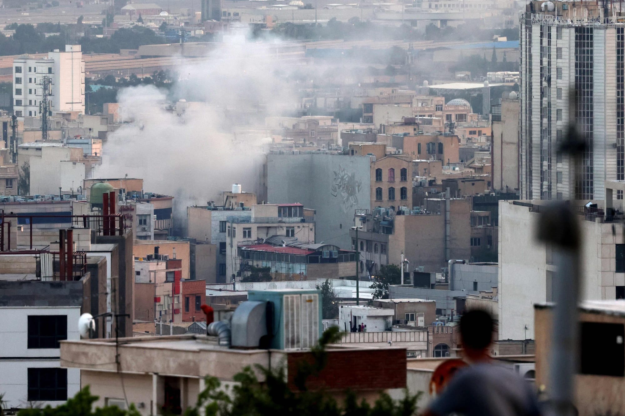 Smoke billows from an explosion in southwest Tehran. 