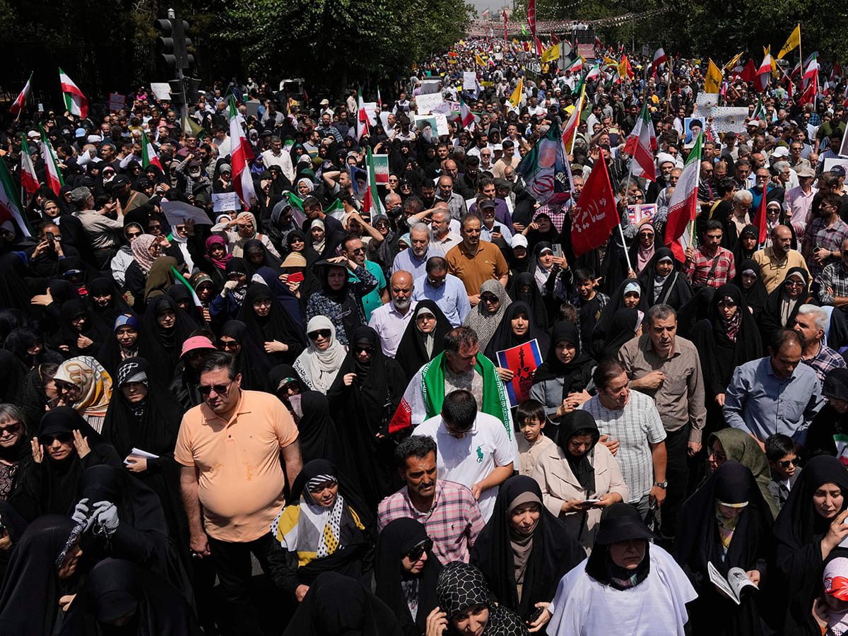 Iranian worshippers attend a protest to condemn Israeli attacks on multiple cities across Iran, after the Friday prayers ceremony in Tehran, Iran, Friday, June 20, 2025. 