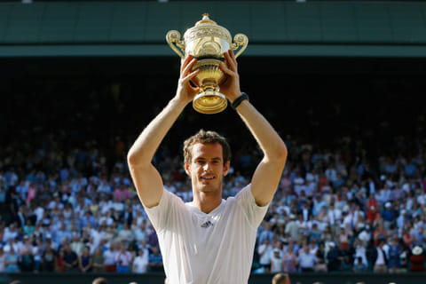 FILE - Andy Murray of Britain poses with the trophy after defeating Novak Djokovic of Serbia in the men