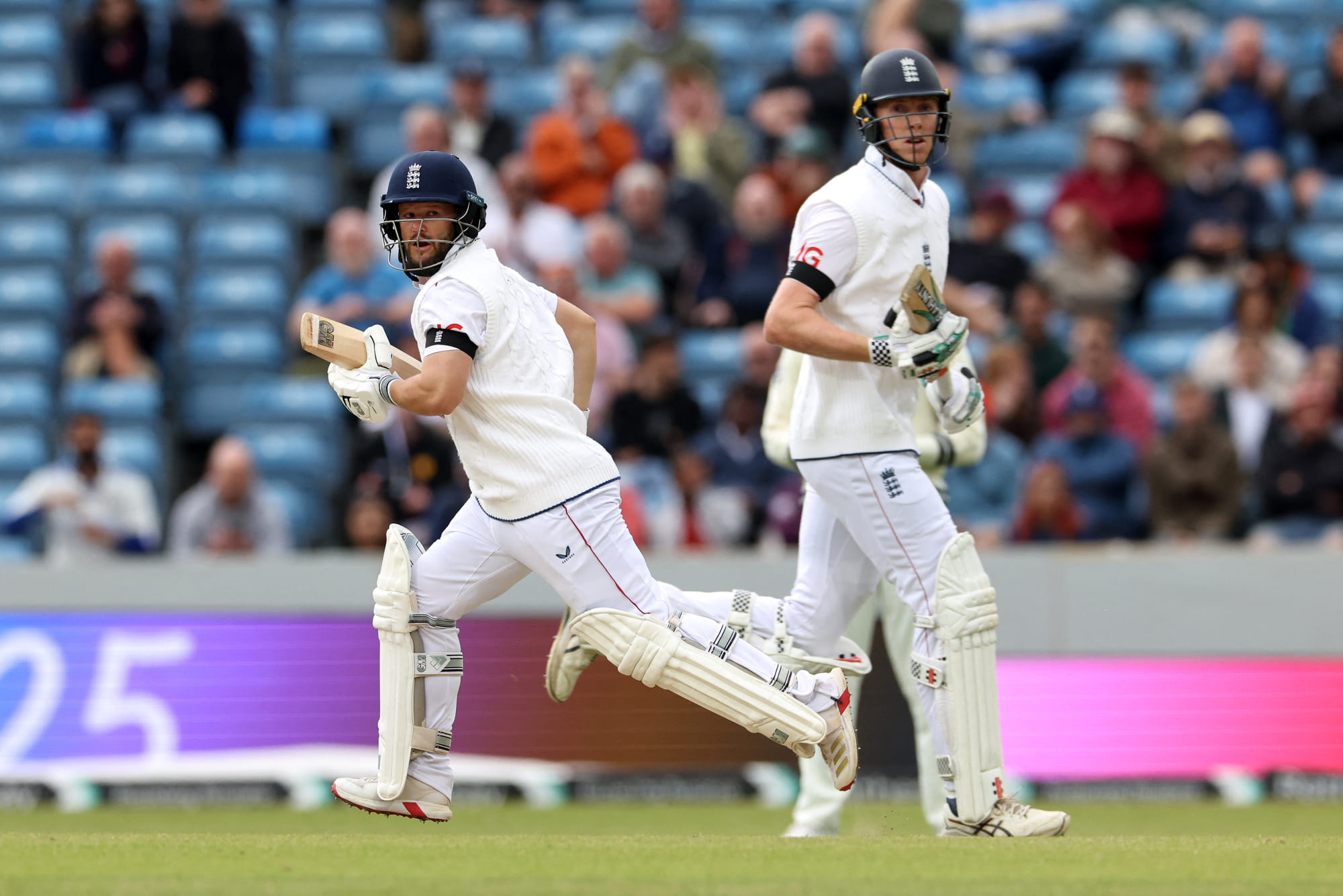 England's Ben Duckett (L) and Zak Crawley run between wickets on day five of the first cricket Test against India at Headingley cricket ground in Leeds, northern England on June 24, 2025.
