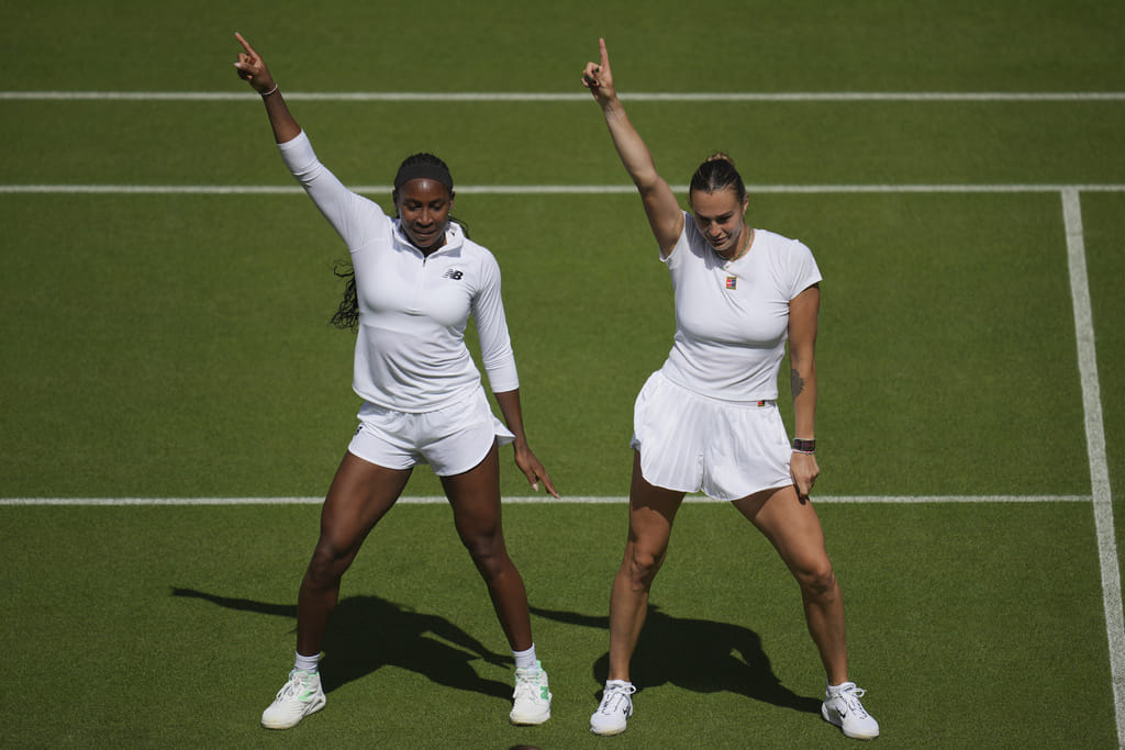 Aryna Sabalenka (right) of Belarus and Coco Gauff of United States dance during a practice session ahead of the Wimbledon Championships in London on June 27, 2025. 