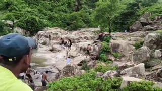 Dramatic video: Women swept by waterfall surge in India, rescued seconds from the edge