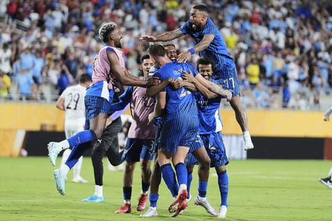 Al Hilal players celebrate after defeating Manchester City the Club World Cup round of 16 football match in Orlando, Florida, on June 30, 2025. 