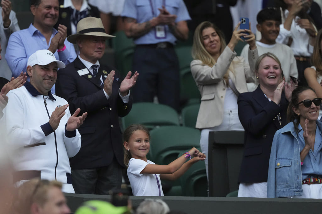 Tara, the daughter of Novak Djokovic of Serbia does a dance as she celebrates her father beating Miomir Kecmanovic of Serbia during a third round men's singles match at the Wimbledon Tennis Championships in London, Saturday, July 5, 2025. AP