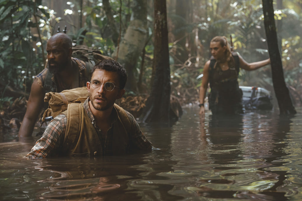 From left: Bechir Sylvain, Jonathan Bailey, and Scarlett Johansson in a scene from " Jurassic World: Rebirth." 