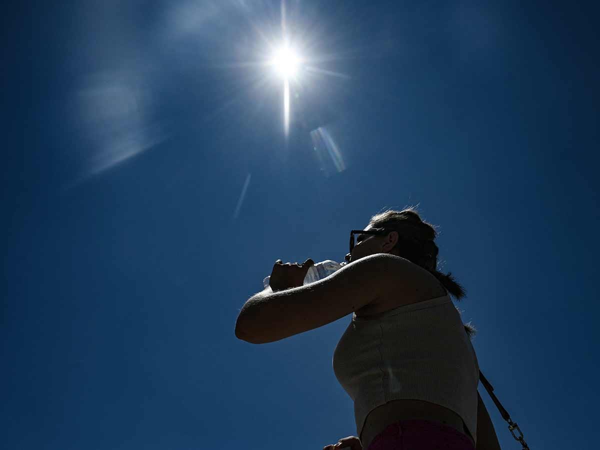 A tourist drinks water during a heatwave in Thessaloniki, Greece.  