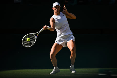 Iga Swiatek routed former Olympic champion Belinda Bencic 6-2, 6-0 on Thursday to reach her first Wimbledon final, where she will face Amanda Anisimova.