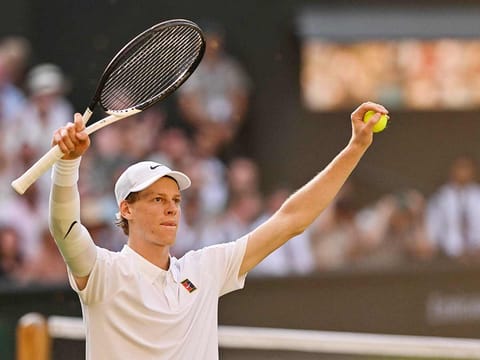 Italy's Jannik Sinner celebrates after victory over Serbia's Novak Djokovic during their men's singles semi-final tennis match of the 2025 Wimbledon Championships at The All England Lawn Tennis and Croquet Club in Wimbledon, southwest London, on July 11, 2025. 