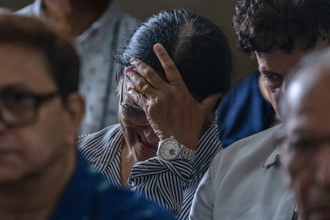 Mother of Clive Kunder, co-pilot of the Air India flight that crashed in Ahmedabad last month, mourns during a prayer meeting for the Air India crew, at a church in Mumbai, India, Saturday, July 12, 2025. 