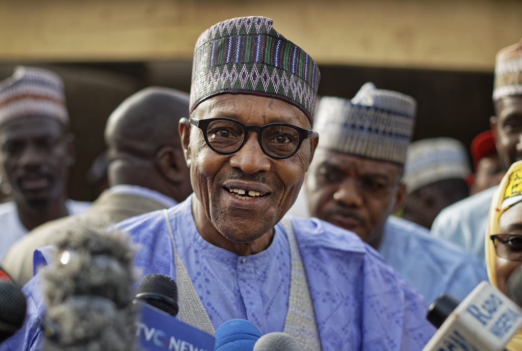 Nigeria's President Muhammadu Buhari speaks to the media after casting his vote in his hometown of Daura, in northern Nigeria,