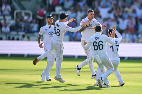 England's Brydon Carse (centre) celebrates with teammates after trapping Indian captain Shubman Gill on the fourth day of the third Test match at Lord's on Sunday.