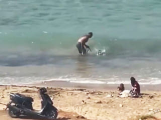 Caught on camera: Man beats dog on Lebanon beach in viral video, sparks outrage 