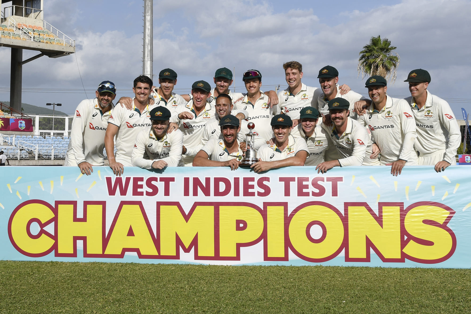Australia's players pose with the trophy after winning on the third day of the third Test cricket match between West Indies and Australia at Sabina Park in Kingston, Jamaica, on July 14, 2025.