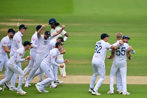 England's captain Ben Stokes (second from right) celebrates with teammates after  review shows India's KL Rahul was trapped LBW on the final day at Lord's on Monday.