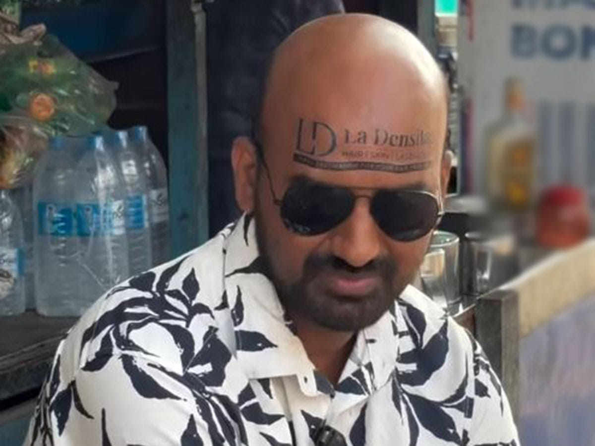Kerala vlogger turns bald head into unique ad space