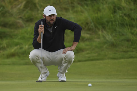 Scottie Scheffler of the United States lines up his putt on the 18th green during the third round of the British Open on Saturday.