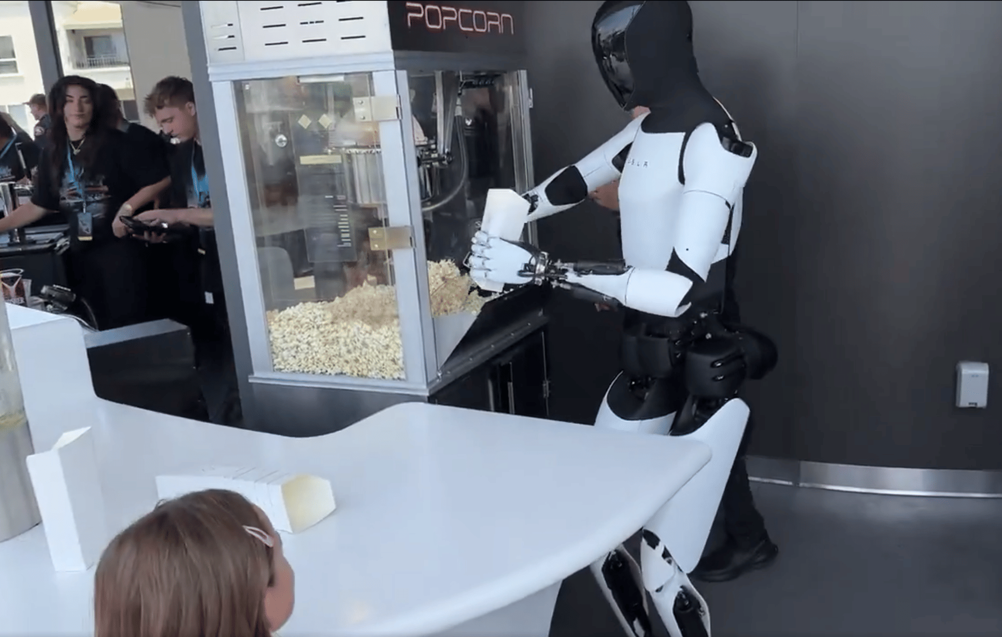 Optimus, a humanoid robot developed by Tesla, demonstrates popcorn making — a glimpse into robotics' advancing capabilities. A recent study by McKinsey highlights that automation like this could transform up to 30% of global work activities by 2030.
