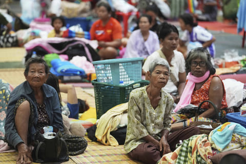 Thai residents who fled homes following clashes between Thai and Cambodian soldiers rest at an evacuation center in Surin province, Thailand, Friday. The border clash between Thailand and Cambodia has sparked a major humanitarian crisis. In just two days of fighting, more than 100,000 people have been forced to flee their homes. Families, including children and the elderly, are escaping in the night, seeking safety amid rising tension and violence.