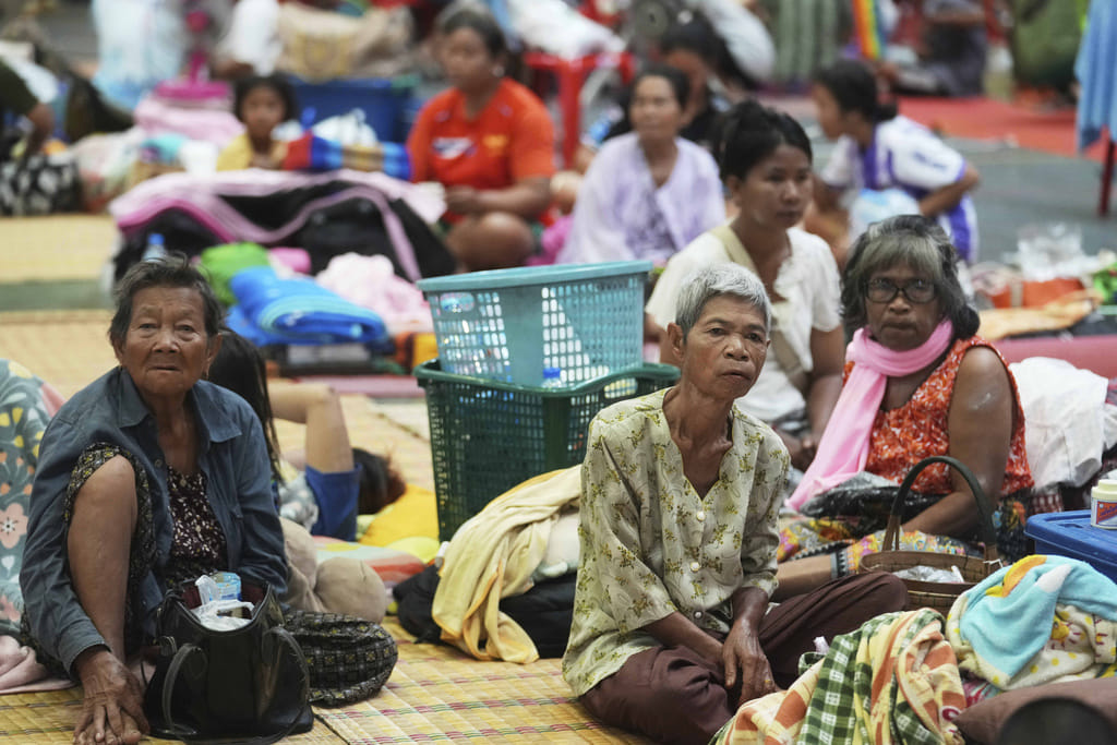Thai residents who fled homes following clashes between Thai and Cambodian soldiers rest at an evacuation center in Surin province, Thailand, Friday. The border clash between Thailand and Cambodia has sparked a major humanitarian crisis. In just two days of fighting, more than 100,000 people have been forced to flee their homes. Families, including children and the elderly, are escaping in the night, seeking safety amid rising tension and violence.