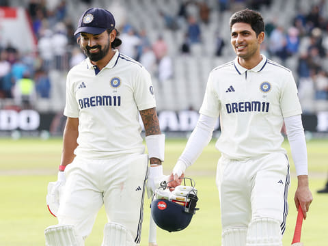India's KL Rahul (L) walks off the field with captain Shubman Gill (R) at the end of play on day four of the fourth Test against England at Old Trafford, in Manchester, north England, on July 26, 2025. 