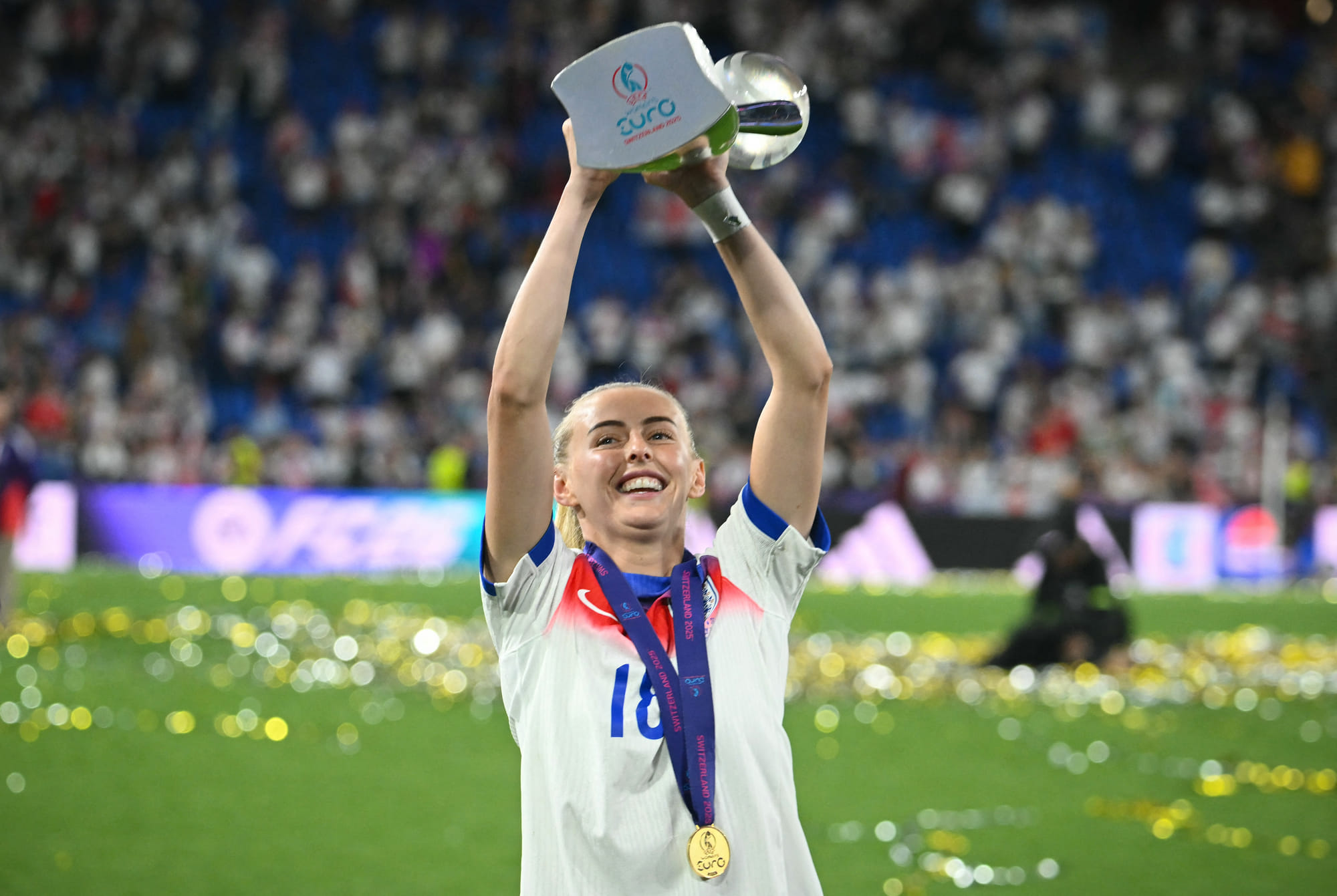 England's forward Chloe Kelly celebrates as she holds the trophy up after England won the Uefa Women's Euro 2025 final football match against Spain at the St. Jakob-Park Stadium in Basel, on July 27, 2025.
