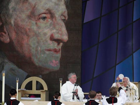 File: Pope Benedict XVI, right, celebrates a beatification mass for Cardinal John Henry Newman in Birmingham, England, Sunday, Sept. 19, 2010.