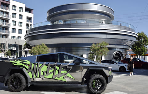 A Tesla Cybertruck drives outside the newly opened Tesla Diner on July 31, 2025 in Hollywood, California.