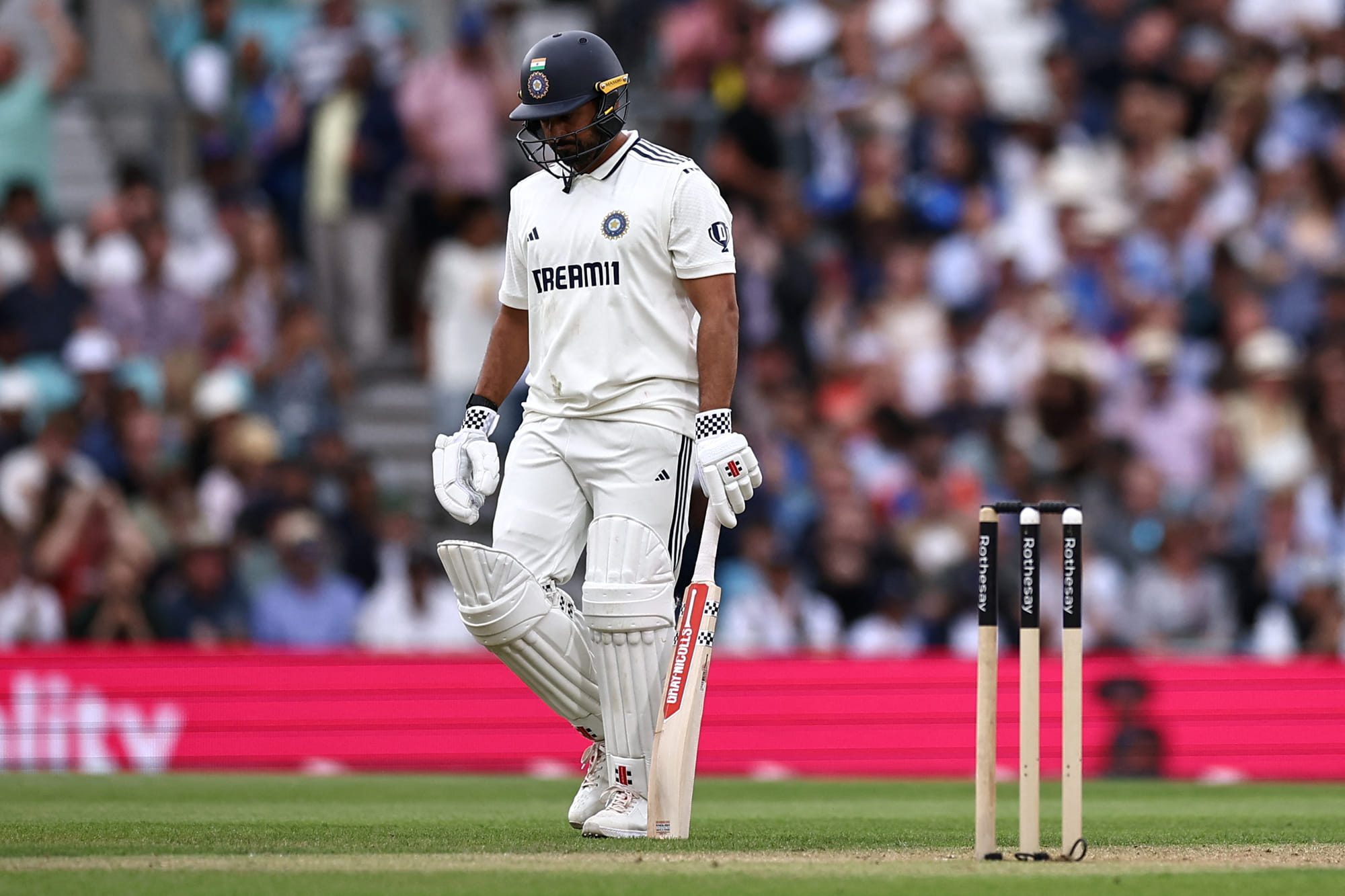 India's Karun Nair walks back to the pavilion after losing his wicket on day three of the fifth Test cricket match against England at The Oval in London on August 2, 2025.