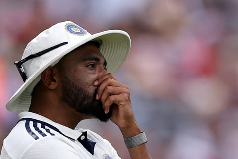 India's Mohammed Siraj reacts after stepping over the boundary line and conceding a six on day four of the fifth Test cricket match between England and India at The Oval in London on August 3, 2025.